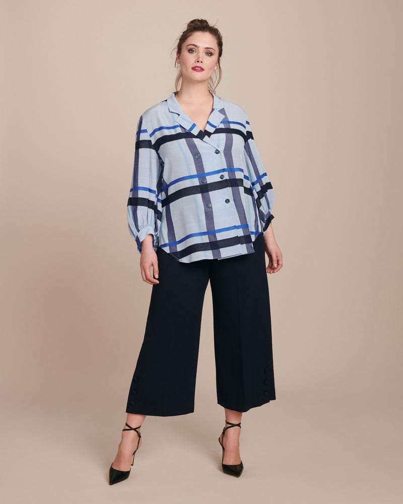 Front of a model wearing a size 16 Cropped Button Placket Pant in Navy by Lela Rose. | dia_product_style_image_id:225751